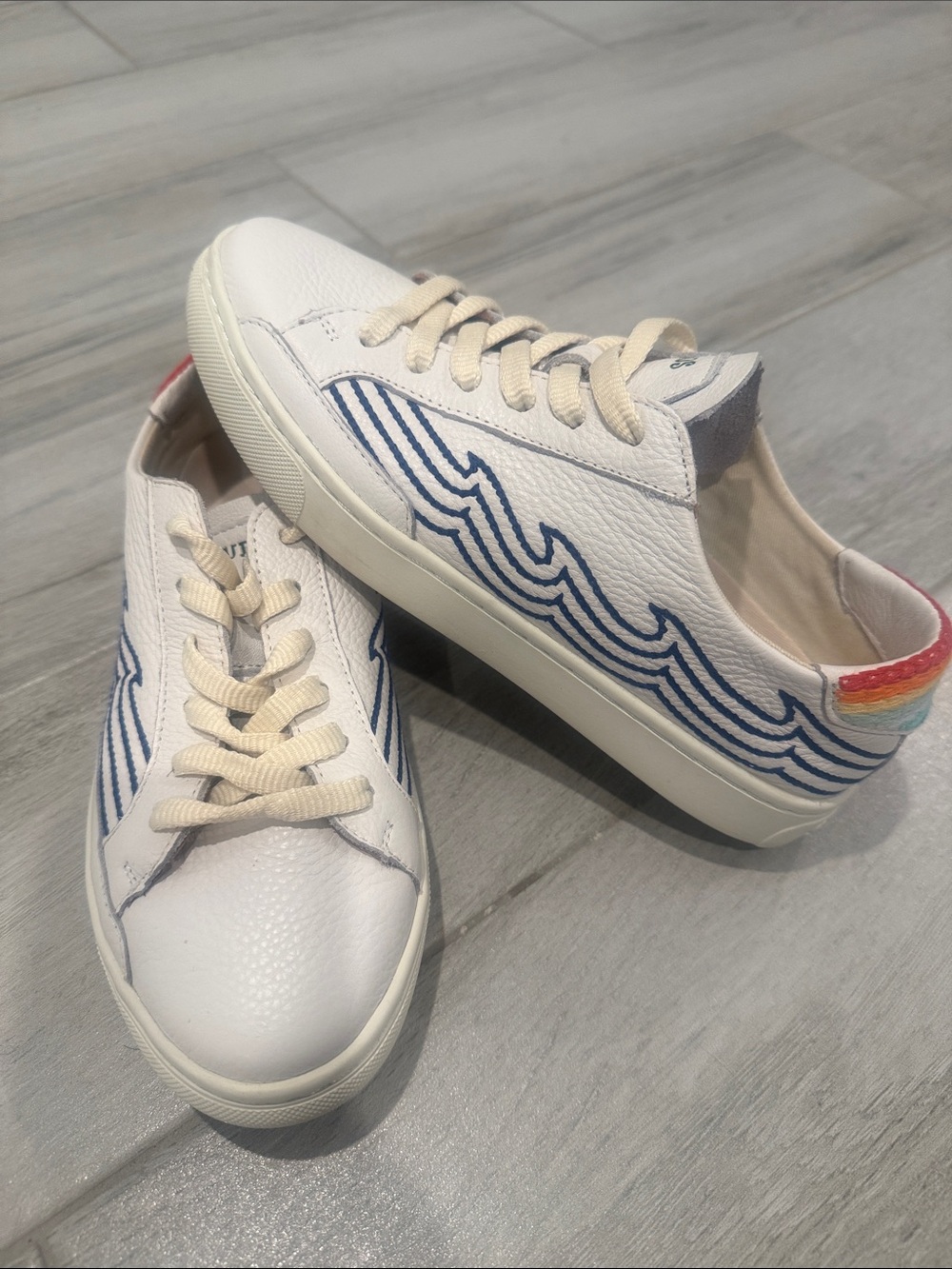 Soludos White Leather Women's Sneakers with Blue Wave Stitching and Rainbow Heel